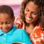 African-American mother reading to her son