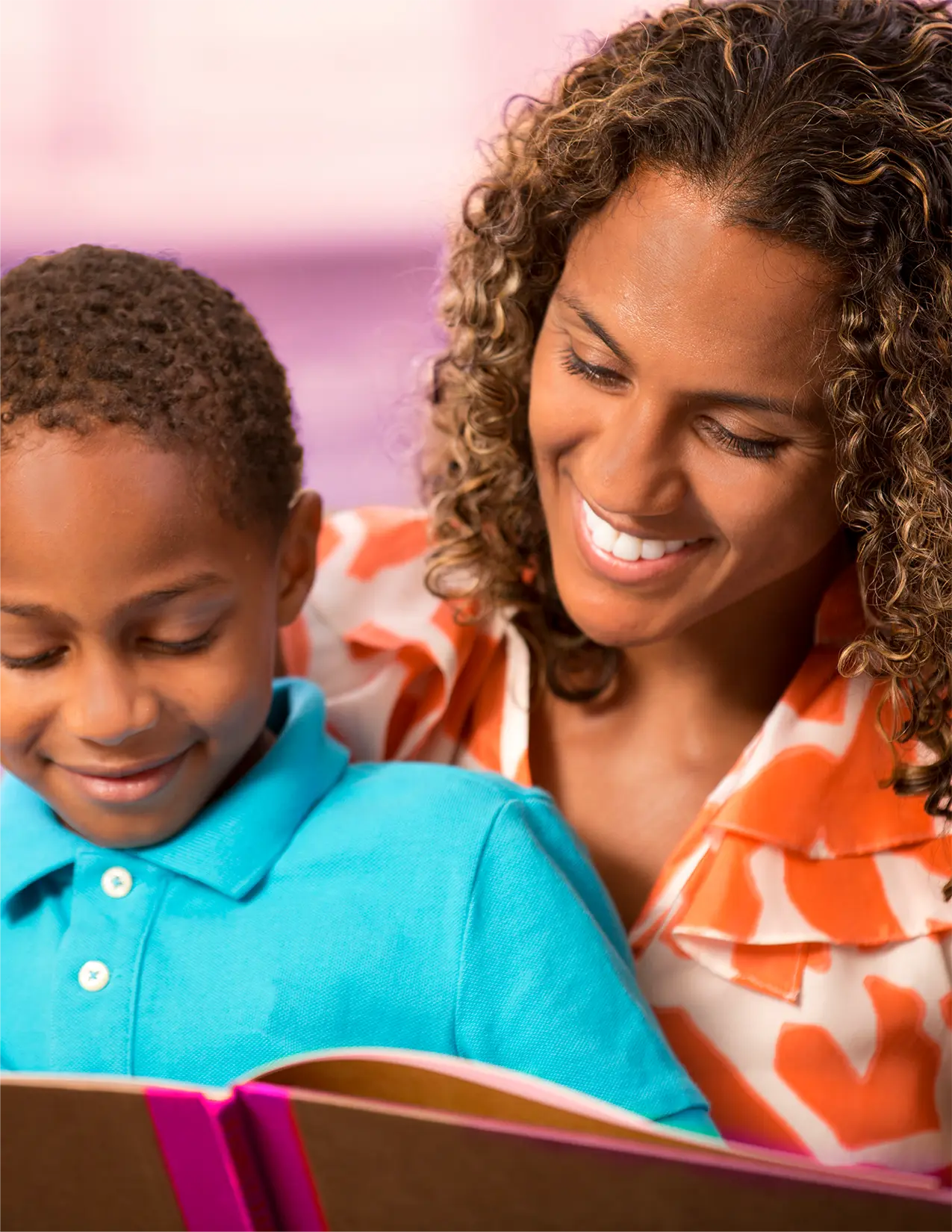 African-American mother reading to her son