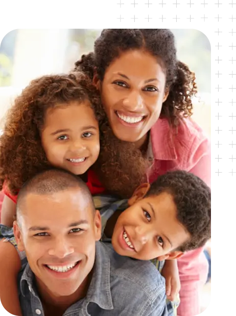 A young African-American family group hugging